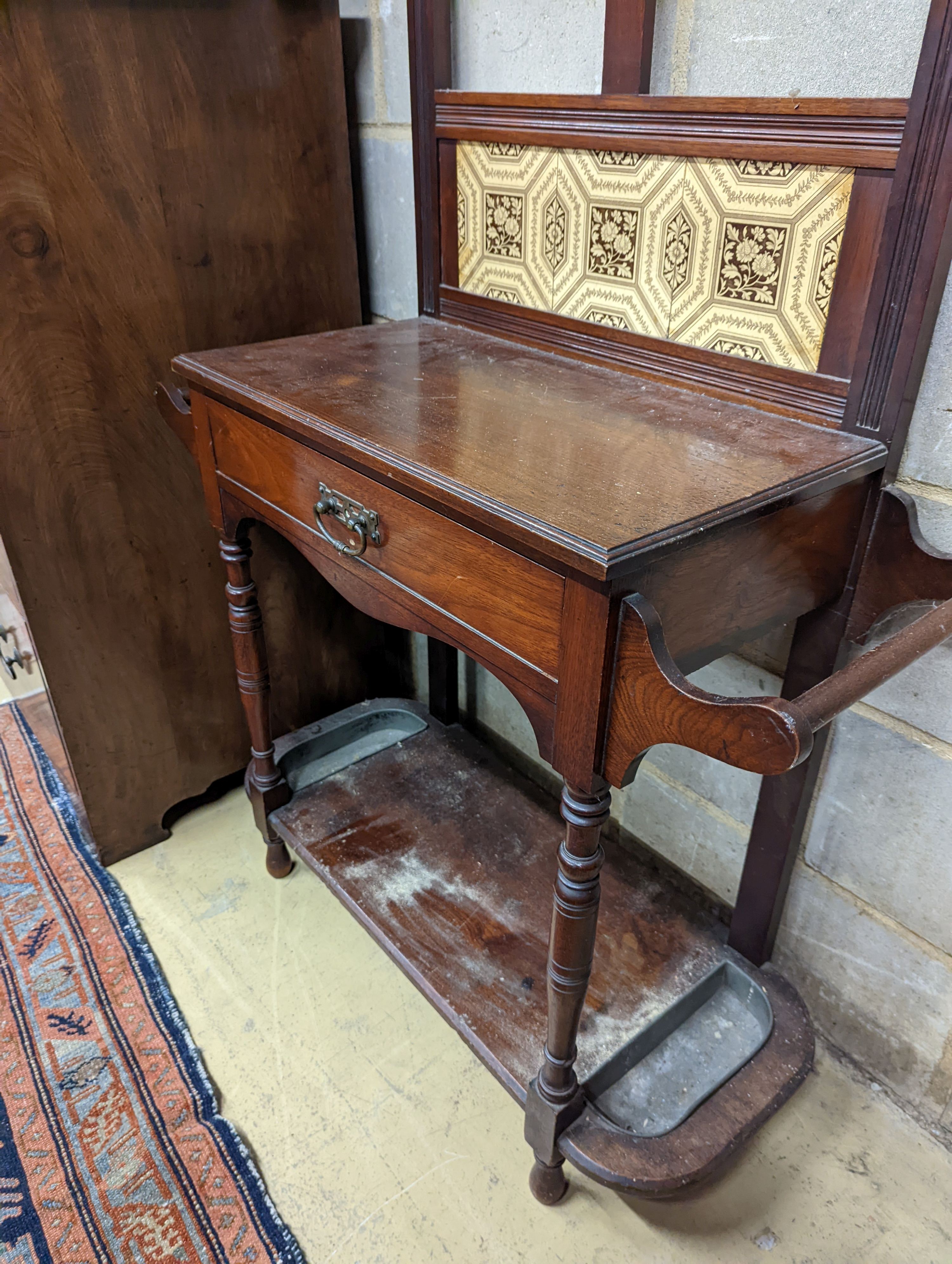 A late Victorian tile-backed mahogany wash stand, width 84cm, depth 34cm, height 184cm